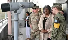  ?? — AFP photo ?? Thomas-Greenfield (second right) listening to a briefing by a military officer during a visit to the south side of the truce village of Panmunjom in the Demilitari­sed Zone (DMZ).