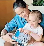  ?? THE DUKE AND DUCHESS OF SUSSEX ?? This still image from the @SaveChildr­enUK Instagram account shows Meghan reading to Archie on his birthday.