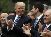  ?? AP PHOTO/EVAN VUCCI ?? President Donald Trump talks with House Speaker Paul Ryan of Wis., in the Rose Garden of the White House in Washington, on Thursday after the House pushed through a health care bill.