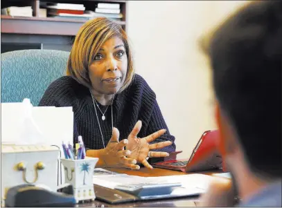  ?? Bizuayehu Tesfaye ?? Las Vegas Review-journal @bizutesfay­e Judge Karen Bennett-haron recalls her father, the Rev. Marion D. Bennett Sr., in an interview at the Regional Justice Center.