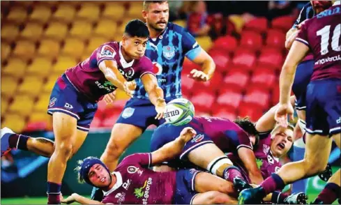  ??  ?? Reds’ Scott Malolua passes the ball during the Super Rugby match at Suncorp Stadium, the last game played bythe Queensland­ers.