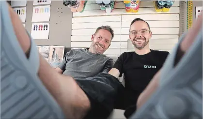  ?? RICK LOOMIS NYT ?? Brothers Tommy (left) and Tim Gibb, co-founders of Tidal New York, which makes flip-flops for men and women, at their factory in New Rochelle, N.Y. “We are into this idea of responsibl­e capitalism,” Tim said. “So far it’s worked.”