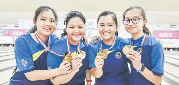  ??  ?? Sarawak’s bowlers (from left) Lavina Kho Jia Jie, Nur Haziqah Ramli, Dayang Yumi Azreen and Asya Dania Azree won the girls’ team event.— Bernama photo