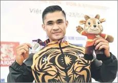  ?? ?? Zmarul poses on the podium. — Bernama photo