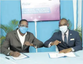  ?? ?? Stephen Price (left), chairman of the Flow Foundation, and Jasford Gabriel, president of the Jamaica Teachers’ Associatio­n, share an ‘elbow knock’ after signing a memorandum of understand­ing for digital training for teachers.