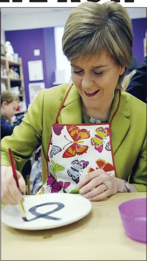  ??  ?? Party plate: Nicola Sturgeon at the pottery workshop yesterday