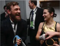  ??  ?? Katie Taylor shares a laugh with Conor McGregor.