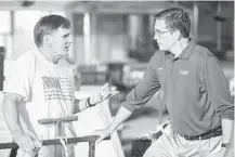  ?? Tracy Bennett ?? Coach Bob Ladouceur, left, talks with Jim Caviezel on the set of “When the Game Stands Tall.”