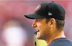  ?? Ross D. Franklin / Associated Press 2013 ?? 49ers head coach Jim Harbaugh has a lot on his plate this season, mixing in newcomers and a new stadium in Santa Clara.