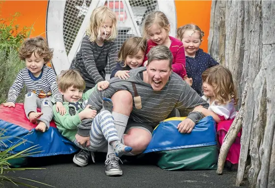  ??  ?? Karen O’Leary at her day job, running Adelaide Early Childhood Centre. She is pictured with, from left, Lenny Evans, 3, Max Joyce, 3, Genevieve Elliott, 4, Maia Townsend, 2, Phoebe Fitzsimons, 3, Sally Meehan, 2, and Iris Mills, 3. Karen plays Officer O’Leary in the TV series Wellington Paranormal, below.