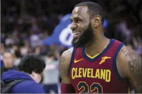  ?? CHRIS SZAGOLA — THE ASSOCIATED PRESS ?? Cavaliers’ LeBron James looks on after a game against the 76ers, Friday in Philadelph­ia.