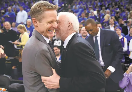  ?? Carlos Avila Gonzalez / The Chronicle 2016 ?? Normally rivals, Spurs head coach Gregg Popovich (right) and Warriors head coach Steve Kerr will guide the U.S. men’s Olympic basketball team.