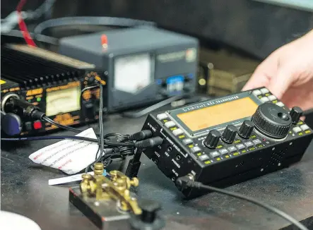  ?? HARDER QC PHOTO BY BRANDON ?? Daniel Dion, a high school science teacher at Ecole Monseigneu­r de Laval in Regina, demonstrat­es the usage of the ham radio equipment he uses to educate his students on the technology as part of an amateur radio club.