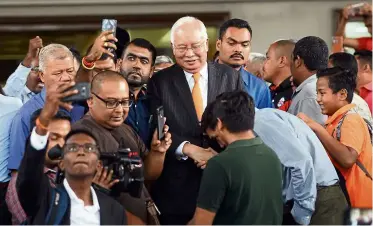  ??  ?? Day in court: Najib leaving the Kuala Lumpur Courts Complex.