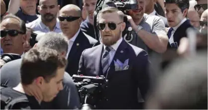  ?? — AP ?? LAS VEGAS: Conor McGregor walks on stage during the arrivals for a boxing match Tuesday, in Las Vegas. McGregor is scheduled to fight Floyd Mayweather Jr in a boxing match Saturday in Las Vegas.