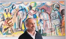  ?? GREG SORBER/JOURNAL ?? Lindsey Gilbert, head of school at Menaul School, in his office in front of a painting created by students, lauded the donors of a recent gift of $1.5 million to the school.
