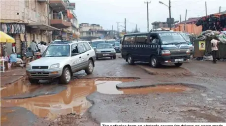  ?? ?? The potholes form an obstacle course for drivers on some roads.