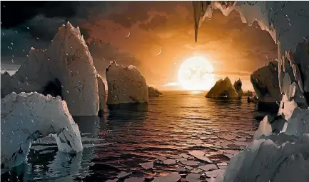  ??  ?? An artist’s depiction shows the possible surface of Trappist1f, one of seven newly discovered planets in the Trappist-1 system.