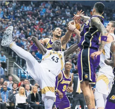  ?? RICK MADONIK TORONTO STAR ?? Raptors forward Pascal Siakam loses his balance while fighting for a rebound Thursday night. Siakam had 16 points.