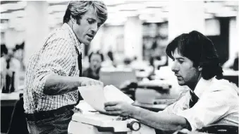  ??  ?? Robert Redford, left, and Dustin Hoffman are shown in a scene from All the President’s Men.