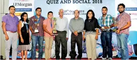  ??  ?? (Above) the winning team with the bank’s Ceo/general Manager Senarath Bandara, Assistant General Manager Trade Services M.M.R.P. Fernanco, Acting Chief Manager Trade Services Kapila Susantha, Senior Manager Yasitha Aluthgedar­a. (Below) The winning team with Deputy General Manager Corporate and Offshore Banking Russell Fonseka, Past President of TFAB A. Kathiravel­uppllai and Assistant General Manager Trade services M.M.R.P. Fernando and Acting Chief Manager Trade Services Kapila Susantha