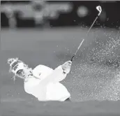  ?? David J. Phillip Associated Press ?? NELLY KORDA shoots from the bunker on the first hole in the final round of the Chevron Championsh­ip.