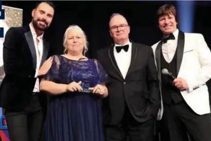  ?? ?? NATIONAL RECOGNITIO­N: Home manager Juliet McNeilly receiving the National Dementia Carer Award and is pictured with special guests Ryan Clark, Brian Johnson, on behalf of Yorkshire and the Humber Care Associatio­n Alliance, and awards ceremony host Steve Walls