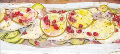  ?? MELISSA D’ARABIAN VIA AP ?? This Jan. 31, 2018 photo shows cod with zucchini and pomegranat­e in Bethesda, Md. This dish is from a recipe by Melissa d’arabian.