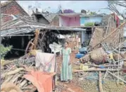  ?? PTI ?? ▪ A woman stands near the debris of her house that was damaged by Cyclone Titli in Andhra Pradesh’s Srikakulam on Friday.