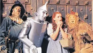  ??  ?? Judy Garland as Dorothy with her friends on their adventure in the 1939 classic
