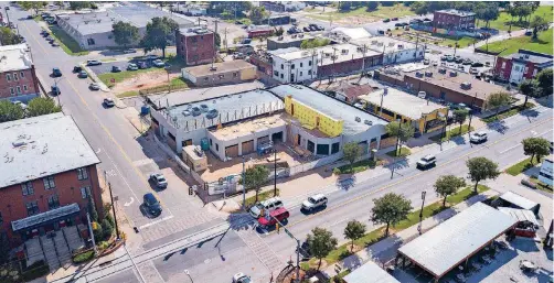  ?? [PHOTO BY DAVE MORRIS, THE OKLAHOMAN] ?? Work has started on a rooftop dining area at the future home of The Collective as shown in this recent drone photo.