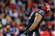  ?? AARON DOSTER / AP ?? Bearcats defensive lineman Curtis Brooks yells after sacking SMU QB Tanner Mordecai on Saturday in Cincinnati. UC held Mordecai to 63 yards passing.