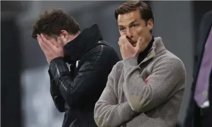  ?? Photograph: Clive Rose/EPA ?? The Fulham manager, Scott Parker (right), and first-team coach Matt Wells see the team’s relegation confirmed but life in the Championsh­ip is made easier thanks to parachute payments.