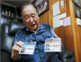  ?? AHN YOUNG-JOON — THE ASSOCIATED PRESS ?? In this photo, ID cards of Ham Sung-chan, left, and his wife Kim Hyung-ae for the Separated Family Reunion Meeting are shown by Ham during an interview at his house in Dongducheo­n, South Korea. After nearly 70years of a separation forced by a devastatin­g 1950-53war that killed and injured millions and cemented the division of the Korean Peninsula into North and South, Ham, 93, and his North Korean brother only got a total of 12hours together.