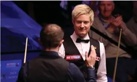  ?? Photograph: George Wood/Getty Images ?? Neil Robertson shakes hands with Jack Lisowski after their second-round match, where the Australian produced a 147 break but still lost.