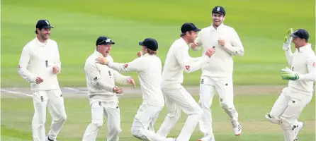  ?? PICTURE: Martin Rickett/nmc Pool/pa Wire ?? Somerset’s Dom Bess (second left) celebrates with his England teammates after running out West Indies’ Roston Chase (see right) during day five of the Third #Raisetheba­t which England won by 269 runs