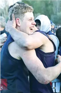  ??  ?? Catani player Paul Pattison celebrates a successful season that netted a league best and fairest and premiershi­p.