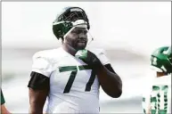  ?? Rich Schultz / Getty Images ?? New York Jets tackle Mekhi Becton will have an MRI on his surgically repaired right knee.