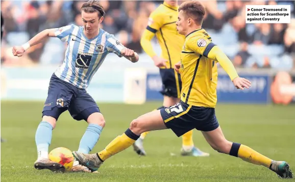  ??  ?? >
Conor Townsend in action for Scunthorpe against Coventry