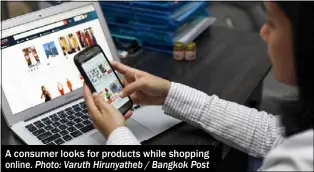  ?? Photo: Varuth Hirunyathe­b / Bangkok Post ?? A consumer looks for products while shopping online.