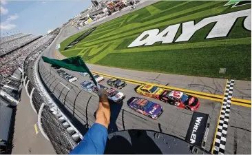  ?? BRIAN LAWDERMILK / GETTY IMAGES ?? stin Dillon, in the No. 3 Dow Chevrolet, leads the field at the start of the Advance Auto Parts Clash exhibition race last weekend at Daytona Internatio­nal Speedway.