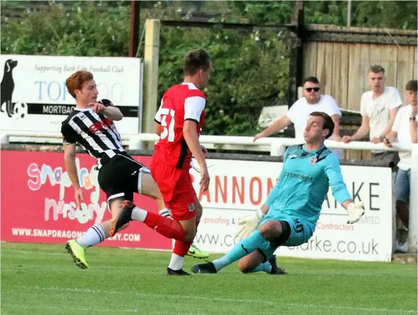  ??  ?? Tom Smith scores one of his two goals