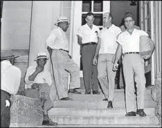  ?? AP PHOTO/FILE ?? Roy Bryant, right, and his half-brother J. W. Milam, second from right, walk down the steps of the Leflore County Courthouse in Greenwood, Miss., on Sept. 30, 1955, after being freed on bond in the kidnapping and murder of Emmett Till. Bryant and Milam...