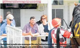  ??  ?? Delighted syndicate manager Nicola Sutherland and her husband Callum discuss the win by Makeitrain with jockey Samantha Collett at last week’s Tauherenik­au meeting while the mare’s co-trainer Guy Lowry (left) looks on.