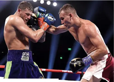  ?? Photo: MIKEY WILLIAMS/TOP RANK ?? HARD GOING: Vlasov’s industry causes Smith problems