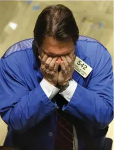  ?? EMMANUEL DUNAND/AFP/GETTY IMAGES ?? A New York Stock Exchange trader reacts to another down day. Despite the daily fluctuatio­ns, markets have rebounded since the start of the year.