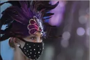  ?? JOSE F. MORENO/THE PHILADELPH­IA INQUIRER VIA AP ?? Showgirl Vanessa Harkins looks on while wearing a face mask during the reopening day of Harrah’s Philadelph­ia Casino and Racetrack in Chester, Pa., Friday, June 26.