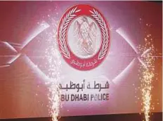  ?? Abdul Rahman/Gulf News ?? Abu Dhabi Police’s new emblem being launched at the Armed Forces Officers Club yesterday. It includes pictures of a palm tree, a falcon, a dagger with red and white colours.