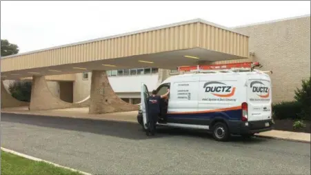  ?? EVAN BRANDT — DIGITAL FIRST MEDIA ?? A truck from an air duct cleaning company leaves Upper Perkiomen High School Thursday. The school has been closed all week due to a mold infestatio­n.