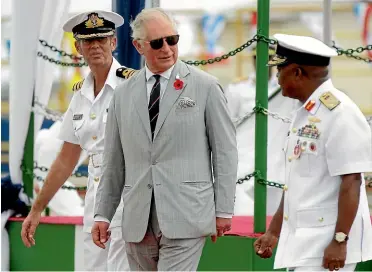  ?? AP ?? Prince Charles disembarks from a naval ship in Lagos, Nigeria.
